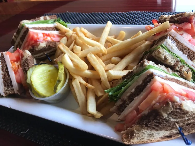 Turkey club sandwich and french fries